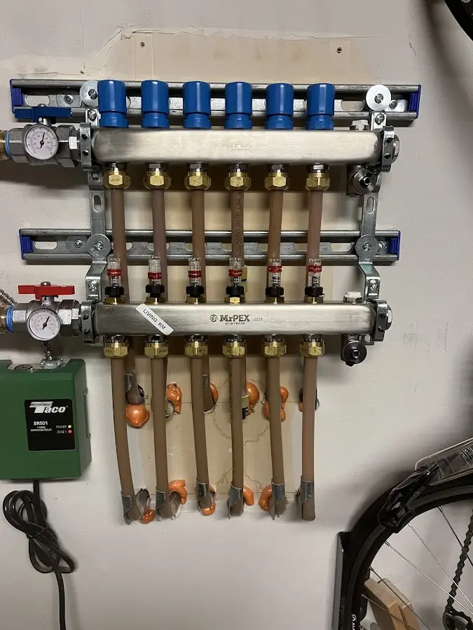 Plumber performing Gas Line Installation at a residential property in Old Westbury